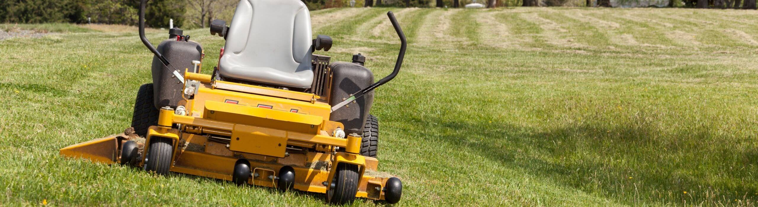 yellow lawn mower on grass